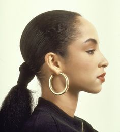 the cover of time magazine with an image of a woman wearing large hoop earrings