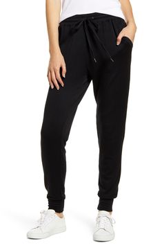 Supersoft and stretchy, these joggers have a slim yet relaxed fit that feels right at home in your casual wardrobe. 27 1/2" inseam Elastic/drawstring waist Front slant pockets 95% modal, 5% spandex Machine wash, tumble dry Made in the USA t.b.d. Sporty Mid-rise Bottoms For Loungewear, Sporty Drawstring Joggers For Lounging, Black Comfort Stretch Joggers For Jogging, Black Comfort Stretch Joggers, Versatile Sweatpants With Comfort Waistband And Tapered Leg, Versatile Sweatpants With Comfort Waistband, Versatile Tapered Leg Sweatpants With Comfort Waistband, Relaxed Fit Athleisure Elastane Pants, Casual Joggers For Leisure