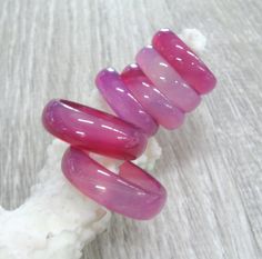 Gorgeous selection of Natural agate carved stone band rings in shades of pale pink and fucshia - available in multiple sizes from 4.5 to 9. Colorful gemstone band rings in boho style, good as stacking rings or to mix and match. Colors and sizes are shown in the photos. Please see all pictures and read. Then select your variation at checkout. Ring sizes and convertion: 4.5, 5, 6 1/4, 6.5, 6 3/4, 7, 7 1/4, 7.5, 9 ( US and Canada ) I 1/2, J 1/2, M 1/2, N, N 1/2, O, O 1/2, P, R 3/4 ( UK and Australi Handmade Adjustable Pink Crystal Ring, Pink Bohemian Rings For Jewelry Making, Handmade Bohemian Pink Ring, Adjustable Pink Gemstone Stackable Rings, Pink Natural Stones Ring Jewelry, Pink Stackable Crystal Ring, Unique Pink Crystal Round Ring, Pink Stackable Round Crystal Ring, Adjustable Pink Stackable Crystal Ring