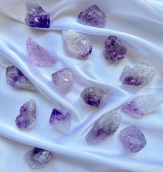 some very pretty purple crystals on a white cloth