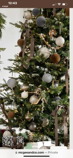 a christmas tree decorated with ornaments and ribbons