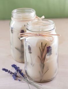 a jar filled with lavender candles sitting on top of a table