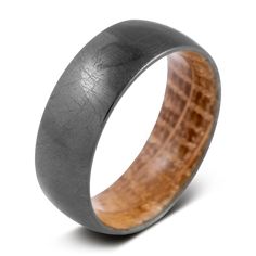 a black ceramic ring with wood inlay