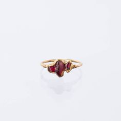 Pairs well with matching Earrings and Pendant! A minimal garnet ring with a comfortable dainty ring shank. Stacks well with other rings, particularly colored gemstone rings. This garnet is completely natural, raw, and uncut. Although Garnets are the birthstone for January, these gems are super trendy and can be worn by and gifted to just about anybody! -Three Genuine Rough Garnet, Uncut -Gem size – 3-5mm each -Pure 14k gold fill Shank -24k Gold Dipped Please read our FAQ for more information on Raw Stone Ring, Ringe Gold, Gold Dipped, Raw Stone, Garnet Rings, Dainty Ring, Gemstone Colors, Matching Earrings, Stone Rings