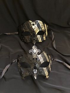 These luxury masks are made of A lightweight metal and are hand painted with a matching gold strip pattern. Both masks have some flex and have black silk ribbon ties attached. Stand out at your next Masquerade ball or mask costume party with these unique masks! Free ground shipping included. French Masquerade, Luxury Mask, Unique Masks, Metal Mask, Luxury Couple, Strip Pattern, Venetian Masquerade, Mask Costume, Costume Masks