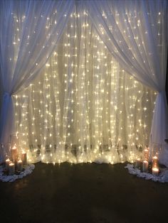 the curtains are covered with white lights