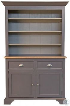 a gray bookcase with two doors and drawers