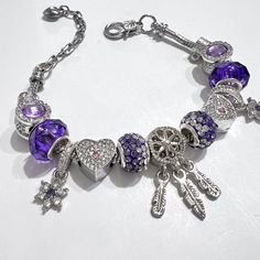 Introducing our stunning Purple Dream Catcher Protective Charm Bracelet, designed for everyday elegance. This vibrant purple bracelet piece is a symbol of royalty and strength, making it a standout addition to any jewelry collection. Crafted with great attention to detail. Get ready for the compliments - this bracelet isn't just a fashion statement; it's a conversation starter. Perfectly designed for women, it adds a touch of sophistication to any outfit while celebrating the beauty of friendship. Looking for the ideal gift? This bracelet is a thoughtful choice for the special women in your life, whether it's a wife, mother, daughter or a dear friend. Celebrate the essence of love and connection with this exquisite creation. Don't miss out on the chance to own or gift this symbol of elegan Trendy Purple Jewelry For Gift, Trendy Purple Crystal Bracelet As Gift, Purple Metal Bracelets As A Gift, Purple Metal Bracelets As Gift, Purple Metal Beaded Bracelet As Gift, Purple Metal Beaded Bracelets As Gift, Trendy Purple Crystal Bracelet Gift, Purple Crystal Bracelet For Jewelry Making, Purple Charms Bracelets For Jewelry Making