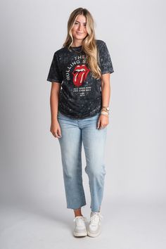 Rolling Stones mineral wash t-shirt from Lush Fashion Lounge women's boutique in Oklahoma City. Lush boutique in OKC has a variety of cute band tees, graphic tees, and more! This trendy vintage Rolling Stones t-shirt is a must have! You are sure to love this iconic graphic tee! Model is 5'9 size 29 wearing size small. 100% cotton Officially licensed made for American Needle by The Rolling Stones. Spring Stonewashed T-shirt In Washed Black, Trendy Bleached T-shirt With Relaxed Fit, Trendy Stonewashed Short Sleeve T-shirt, Edgy Washed Black T-shirt For Spring, Trendy Stonewashed T-shirt For Spring, Trendy Stonewashed Cotton T-shirt, Trendy Faded Bleached T-shirt, Trendy Stonewashed T-shirt For Summer, Trendy Washed Black T-shirt