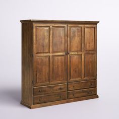 an old wooden armoire with two drawers on one side and three doors on the other