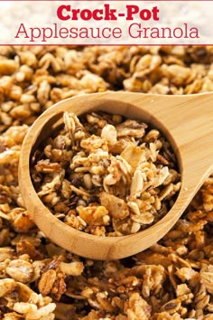 a wooden spoon filled with granola and nuts