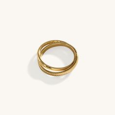 Introducing the Dual Band Ring, a modern and chic accessory crafted with precision and plated in radiant 18K gold. Featuring two bands elegantly intertwined, this ring adds a touch of sophistication to any outfit. Wear it alone for a minimalist look or stack it with other rings for added flair. With its versatile design and timeless appeal, the Dual Band Ring is sure to become a staple in your jewelry collection. Stainless Steel, plated with 18K Gold Waterproof (Tarnish Resistant) Natural Linen Adjustable Gold Rings For Layering, Elegant Gold Stackable Rings For Layering, Modern Adjustable Gold Bands, Gold Double Band Tarnish Resistant Rings, Gold Double Band Stackable Rings With Modern Twist, Timeless Gold Double Band Stackable Rings, Timeless Double Band Gold Bands, Gold Tarnish-resistant Double Band Rings, Timeless Gold Double Band