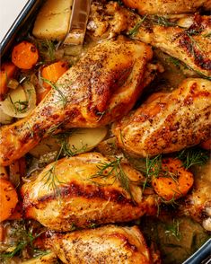 chicken, carrots and potatoes in a roasting pan