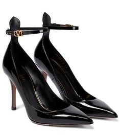 Step into the Tan-Go pumps from Valentino Garavani for effortless glamour. Made from glossy black patent leather, the pointed-toe style has an adjustable strap with a gold-toned VLogo buckle. | Valentino Garavani Tan-Go patent leather pumps Luxury Patent Leather Heels With Buckle Closure, Evening Patent Leather Heels With Buckle Closure, Luxury Heels With Heel Strap For Office, Luxury Office Heels With Heel Strap, Patent Leather Ankle Strap Court Shoes For Work, Luxury Glossy Pointed Toe Heels, Luxury Court Shoes With Heel Strap For Work, Luxury Glossy Finish Pointed Toe Heels, Luxury Pointed Toe Heels With Glossy Finish