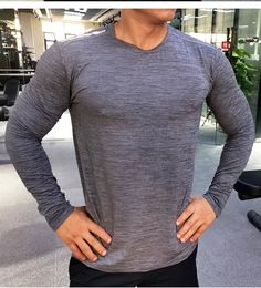 Compression Rashguard Men’s Gym & Sports Long Sleeve T Shirt Long Sleeve Athleisure T-shirt For Running, Gray Go-dry Tops For Light Sports, Gray Long Sleeve T-shirt For Workout, Gray Crew Neck Top For Light Sports, Stretch Athletic Heather T-shirt For Gym, Athletic Heather Stretch T-shirt For Gym, Long Sleeve Sportswear T-shirt For Workout, Athletic Heather Moisture-wicking Crew Neck Activewear, Gray Athletic Fit Crew Neck Activewear