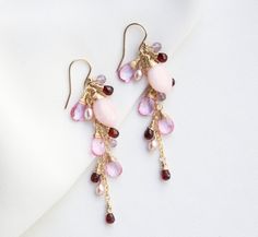 A beautiful and romantic addition to your accessory collection. Each earring features mixed of different colour gemstones (pink Opal, mystic pink Topaz, red Garnet, pink Amethyst, and Pink Pearl), gradually hand wrapped in 14k gold filled, and dangling from a 14k gold-filled ear hook. P R O D U C T * D E T A I L S Metal - 14K gold filled Stone -  Pink Opal, mystic pink Topaz, red Garnet, pink Amethyst, and Pink Pearl Colour - Multi colours (Pink and red) Stone Size - Range from 3-9 mm Earring Si Ocean Jewelry, Jewelry Picture, Pink Topaz, Gemstone Jewelry Handmade, Pink Amethyst, 925 Silver Jewelry, Ear Hook, Wire Earrings, Red Stone