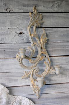 Large shabby chic triple candle wall sconce. Hand painted in soft grey and accented in gold with a protective coating. Manufactured by Syroco in the 1950's, of Syroco Wood.The sconce holds 3 taper candles and has a hanger on the back. 21.25" tall, 10.25" wide and 3.25" deep All orders placed before 5 p.m. EST will ship the following business day. >More> Candle Holders & Lamps Candle Sconces Living Room Wall Decor, Country Lamps, Painted Wood Walls, Sconces Living Room, Crystal Wall Lighting, Shell Candles, Bathroom Candles, Antique Candles, Candle Wall