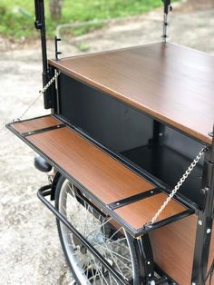 a bike with a wooden shelf attached to it