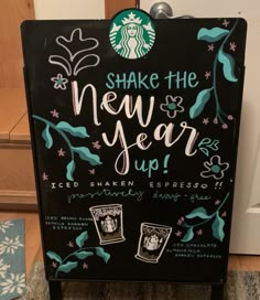 a sign that says shake the new year up with pictures of starbuckss on it