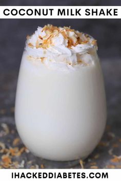 coconut milkshake in a glass with whipped cream on top