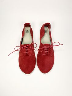 "100% Red Italian Leather 100% Handmade! Soft Laced up Flats Shoes These cute Oxfords flat shoes are very soft and stylish, they will lift up all of your outfits, you will look gorgeous when wearing them! ► Made to order low heel oxfords, I will be delighted to personally handcraft a pair especially for you! ► Upper in red buttery Italian Leather Suede ► Available in so many colors, browse thru my shop and let me know the color you prefer, https://www.etsy.com/shop/elehandmade I can craft the sh Casual Suede Lace-up Flats, Chic Red Leather Ballet Flats, Casual Lace-up Leather Ballet Flats, Red Leather Ballet Flats With Red Sole, Casual Flat Oxfords With Textured Sole, Slip-on Flats With Red Sole, Spring Suede Ballet Flats With Rubber Sole, Casual Summer Lace-up Oxfords, Red Ballet Flats For Spring