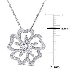 A floral for all seasons, this moissanite flower necklace refreshes your look, crafted in sterling silver. A gaze-grabbing single round lab-created moissanite centers an open moissanite-paved flower blooming with vibrant details and not so subtle dazzle. Naturally found in meteorites, lab-created moissanite gemstones are ultra-resilient with a disco-ball light effect that provides unparalleled sparkle. The total diamond equivalent weight is approximately 1 1/10 carats. | Moissanite Flower Neckla Diamond Jewelry With Flower Charm For Anniversary, Sterling Silver Diamond Flower Pendant Necklace, Diamond Flower Charm Jewelry For Anniversary, Silver Diamond Necklace With Flower Charm, Brilliant Cut Flower Pendant Jewelry, Sterling Silver Necklace With Diamond Accents In Flower Shape, Sterling Silver Flower Necklace With Diamond Accents, Anniversary Diamond Necklace With Flower Pendant, White Diamond Flower Pendant Necklace In Sterling Silver