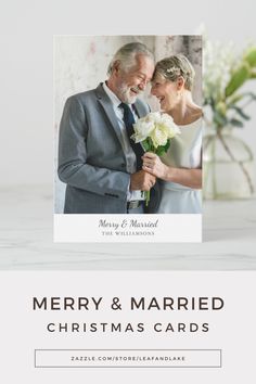 a merry and married christmas card with a couple holding flowers