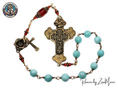 Skillfully handmade by expert artisan Zina Marie, this exquisite rosary features a stunning Kant-Tangle design of Our Lady of Guadalupe. This intricate (18" Circle) piece is crafted with high-quality jade and agate gemstone beads, complemented by bronze and brass components - resulting in a truly exquisite devotional piece.  Components of This Pocket Rosary -  -Beads: 10mm Sea Blue/Green Faceted Round Jade & 4mm Round and Barrel Red Agate  -Cross: Bronze Our Lady of Guadalupe 3" -Centerpiece: Br Bohemian Rosary With Natural Stones For Gifts, Handmade Artisan Rosary, Handmade Spiritual Rosary, Handmade Crucifix Rosary For Meditation, Handmade Spiritual Rosary With Crucifix, Blue Rosary With Round Beads For Healing, Turquoise Rosary With Round Beads, Adjustable Green Rosary With Round Beads, Blue 108 Beads Spiritual Rosary