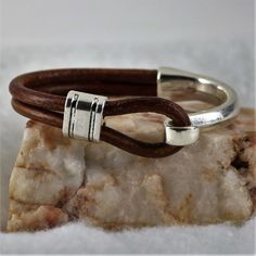 Stylish and sophisticated, this Silver Half Cuff Hook Bracelet is just the right addition to anyone's wardrobe. Basic and rugged enough for him yet still stylish enough for her. Looks fantastic in jeans and a sweater and looks just as fabulous dressed for a night on the town. #bracelets #leather #bracelet #jewelry #accessories #braceletsforwomen #couplesfashion #menswear #giftforher #family #beautiful #mother #happymothersday #mothersdaygifts #bracelets #leather #jewelry #accessories Leather Ideas, Hook Bracelet, Bracelet Christmas, Lovers Necklace, Men Bracelet, Dog Jewelry, Bracelet Leather, Fitness Bracelet, Mens Leather Bracelet