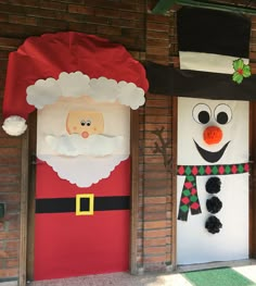 two christmas door decorations with santa clause and snowman on the front, behind them is a brick wall