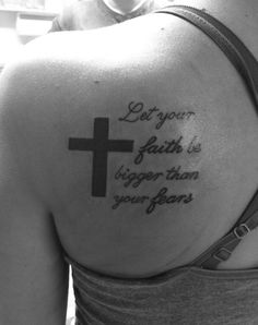 the back of a woman's shoulder with a tattoo saying, don't let your faith be bigger than your fear