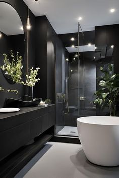 a black and white bathroom with an oval bathtub