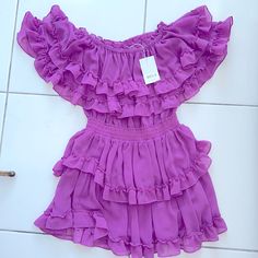 Never Worn, Tags Still On - Adorable Yet Sexy Magenta Dress. Detailed With Layered Ruffles And A Band Around The Waist To Enhance Your Curves. Lavender Ruffled Dress For Party, Lavender Ruffled Party Dress, Lavender Party Dress With Ruffles, Purple Ruffled Hem Dress For Party, Chic Purple Mini Length Dresses, Chic Purple Mini Dresses, Fitted Purple Ruffle Dress For Party, Lavender Ruffled Dress For Date Night, Purple Dress With Ruffle Hem For Party