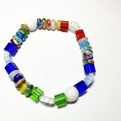 Colors of all kind on this fun and wacky stretch bracelet. Available in sizes 6 inches and 7 inches. Playful Adjustable Multicolor Charm Bracelet, Adjustable Multicolor Stretch Bracelet For Friendship, Colorful Adjustable Casual Stretch Bracelet, Adjustable Colorful Casual Stretch Bracelet, Casual Colorful Adjustable Stretch Bracelet, Multicolor Novelty Wristband For Gifts, Casual Rainbow Stretch Bracelet As Gift, Colorful Casual Plastic Bracelets, Casual Multicolor Stretch Bracelet With Colorful Beads