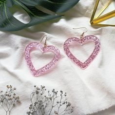 Sparkly, yet simple. These cute glittery earrings will dazzle anyone! You will receive one pair. Acrylic Zinc alloy metal Hook type Pink Heart Earrings, Pink Acrylic, Glitter Earrings, Pink Acrylics, Heart Dangle Earrings, Heart Shaped Earrings, Glitter Hearts, Pink Earrings, Girls Earrings