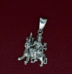 Indian Hindu Idols Blessing Goddess Bhawani/Durga/Santoshi maa with lion vintage antique style stunning divine pendant, best gifting unisex jewelry from India. Metal-925 sterling silver. Item type-Pendant Weight-3.060 grams. Height-3.5 centimeter. Width-2.0 centimeters. Stamped-925. Finish-Oxidized. note: chain is not included in this price Make excellent gifting and collectible pieces(gift for birthday, wedding, anniversary, mother's day, fathers day, Christmas day,) We take absolute care of pr Symbolic Jewelry For Puja And Navratri, Symbolic Jewelry For Navratri Puja, Spiritual Oxidized Jewelry For Navratri, Spiritual Locket Jewelry For Navratri, Silver Spiritual Locket Jewelry, Symbolic Silver Jewelry For Festivals, Silver Spiritual Jewelry For Navratri, Sterling Silver Jewelry For Puja And Festivals, Spiritual Sterling Silver Jewelry For Navratri