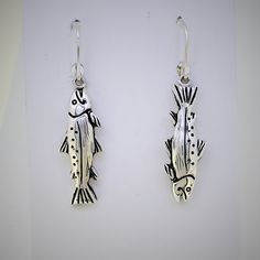 "For the fisherman / fisherwoman...these steelhead earrings are super realistic and highly detailed. Solid sterling silver earrings and lever back ear wires. Designed and manufactured by me in my studio. I hand carved the original wax model and did the casting and finishing to bring these superb steelhead earrings to the world! -fish are about 1 1/8 \" long -solid sterling silver - hyper realistic -steelhead are a highly prized game fish in the northwest gift boxed" Silver Sterling Fish-shaped Earrings, Silver Fish-shaped Sterling Silver Earrings, Silver Fish-shaped Earrings With Ear Wire, Silver Fish-shaped Earrings With Fish Hooks, Nickel-free Silver Fish-shaped Earrings, Fish Earing, Steelhead Fishing, Fish Earrings, Whimsical Fashion