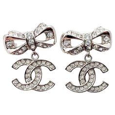 New In Boxchanel Crystal Bow Drop Earrings In Silver. Vintage And In Pristine Condition! Selling On 1stdibs For $999 Chanel Silver Ribbon Cc Dangle Crystal Piercing Earrings *Marked 18 *Made In Italy *Comes With Original Box And Pouch Vintage 2010s Collection Approximately 0.75" X 0.6" Dimensions Height: 0.75 In (19.05 Mm) Width: 0.6 In (15.24 Mm) Piercing Earrings, Silver Ribbon, Stylish Earrings, Chanel Jewelry, Original Box, Silver Tone, In Italy, Chanel, Ribbon