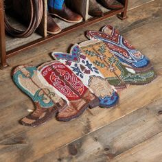 the rugs on the floor are made to look like cowboy boots and other items