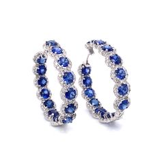 Stylish hoop 18k white gold earrings with blue sapphires and diamonds. Sapphires are round cut Ceylon blue gems 13.58 ct total. Accented by white round diamonds 3.98 ct in total. Diamonds are white and natural and in G-H Color Clarity VS. 18k white gold Length: 3 cm diameter Weight: 15 g [shortcode] [video] [/video] [/shortcode] Diamond Sapphire Earrings, Sapphire Hoop Earrings, Sapphire Jewellery, Blue Sapphire Earrings, Blue Sapphire Jewelry, Diamond Tops, White Gold Hoop Earrings, Platinum Bracelet, White Gold Hoops