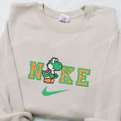 Introducing the Yoshi x Nike Cartoon Embroidered Shirt, the perfect blend of style and nostalgia. This unique shirt features an eye-catching embroidered design of everyone’s favorite dinosaur, Yoshi, in collaboration with the iconic Nike logo. Made from premium quality cotton, it offers a soft and comfortable feel that keeps you at ease all day long. [...] Nike Christmas Clothes, Nike Embroidery Christmas Sweatshirt, Christmas Crewneck Sweatshirt Nike, Christmas Embroidery Sweatshirts Nike, Nike Christmas Sweatshirts, Christmas Crewneck Nike, Nike Christmas, Nike Cartoon, Movie Christmas