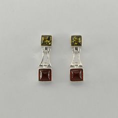 This is a pair of beautiful BALTIC AMBER Earrings from Gdańsk / Danzig, Poland. The earrings are made out of solid 925 Silver and there is no nickel or other substances causing most allergies. This makes the earrings hypo allergenic. Size of one Earring 2.3 x 0.7 cm or  0.91 x 0.28 inch You will receive the item in a gift box - perfect to surprise someone or yourself. Usually we ship on the same day we receive the payment for the order. We want you to be happy with your purchase. If you do not l Sterling Silver Rectangular Gemstone Earrings, Silver Rectangular Stone Earrings For Formal Occasions, Silver Rectangular Stone Sterling Silver Earrings, Amber Earrings, Gdansk, Baltic Amber, Post Earrings, Allergies, Jewelry Earrings Dangle