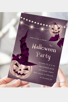 a person holding up a halloween party card