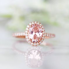 Beautiful Classic Morganite Halo Ring ►Base Metal: Sterling Silver (S925) ►Plating: 14K Rose Gold Vermeil ►Accented With Simulated Diamonds Main Stone: Morganite Stone Creation: Lab-Created Color: Peachy-Pink Stone Cut: Oval Gem size: 8.0 x 6.0 mm Carat Weight: 1.21 ct. Stone Origin: Russia ►Please be aware that plated jewelry can wear off over time, if this is a concern we would suggest going with the sterling silver or solid gold jewelry option. ►Solid gold morganite ring can be purchased at: Classic Rose Gold Morganite Wedding Ring, Classic Pink Halo Ring, Classic Rose Gold Rings With Accent Stones, Classic Morganite Diamond Ring For Wedding, Classic Morganite Diamond Wedding Ring, Oval Rose Gold Birthstone Ring For Anniversary, Morganite Fine Jewelry For Anniversary, Blush Gemstone Rings As Gift, Blush Gemstone Rings For Gifts