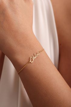 ✨ Made of 925 Sterling Silver  and Solid Gold Materials✨ 💕 Dainty Name bracelets are really trendy. An elegant piece to have in your collection. 🎄 Gold Name Bracelet will be a great gift for your loved ones. 🌙Perfect gift for Mothers Day Personalized 14k Gold Name Bracelet is the most favorite choice of recent times. Named Gold Bracelet is carefully handcrafted by our very experienced craftsmen. Name Bracelet is an elegant jewel. Name Signature Bracelet can really make your loved ones emotional. You can choose it as a Mothers Day Gift for your mom. Made of 100% 925 Sterling Silver. We can prepare 8k - 14k - 18k Solid Gold or Silver according to your preference. Personalized 14k Gold Box Chain Name Bracelet,  Custom Name Bracelet, Valentine Day Gifts for Her, Handmade Gift for Mom, Mothe 14k Gold Name Bracelets For Everyday, Dainty Jubilee Bracelet Jewelry For Mother's Day, Elegant Personalized Gold Chain Bracelet, Elegant Yellow Gold Name Chain Bracelet, Elegant Silver Gold-plated Name Bracelet, 14k Gold Name Bracelet Jewelry, Dainty Gold-plated Name Bracelet With Jubilee Design, Gold Plated Dainty Name Bracelet With Jubilee Design, Dainty Gold Plated Charm Bracelet For Anniversary