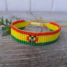 Loom beaded bracelet with Bolivia flag. Patriotic hand woven beads wristbandt is a great gift for a men, women, girl or child for Birthday, Christmas, Valentine's Day and other holidays. Also, this jewelry with South America country symbol can be a small spiritual gift for a friend who is homesick. Is suitable for daily wear. Bracelet in stock and ready to ship. More bracelets with flags here: https://www.etsy.com/shop/BeadSeeShop?ref=seller-platform-mcnav&section_id=36120104 The bracelet is mad Symbolic Multicolor Beaded Bracelets As Gift, Multicolor Beaded Bracelets As Gift, Symbolic Multicolor Beaded Bracelets With Round Beads, Symbolic Multicolor Beaded Bracelets, Casual Handwoven Beaded Bracelets As Gift, Handwoven Friendship Bracelets With Round Beads, Gift Handwoven Braided Bracelets With Round Beads, Yellow Beaded Friendship Bracelets As Gift, Handmade Symbolic Beaded Bracelets As Gift