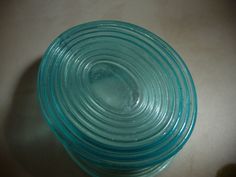 a stack of glass bowls sitting on top of a table