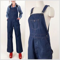 70s indigo dark wash wide leg bib overalls. Stiff denim fabric, may be a blend, with orange contrast stitching, embossed buttons and carpenter pockets. Seem almost unworn except for a fade on the leg - please see photos. In overall great vintage condition.   All measurements are taken with the garment laying flat and doubled for the bust, waist, and hips.  Waist: 32" Hips: 40" Rise to Waist: 12.5" (taken at top of waistband) Rise to Shoulder: 31" at longest strap length / 28" at shortest strap length Upper Thigh: 12.5"across Inseam: 29.5" Length (shoulder to hem): 59" at longest strap length / 56" at shortest strap length Label: Missing Size on Tag: N/A Approx. Fit: 29-31 waist depending on desired fit  Some garments have been adjusted in photos to fit the form. Please reference measuremen Retro Dark Wash Cotton Denim Jumpsuit, Dark Wash Utility Denim Jumpsuit With Bib Front, Utility Style Dark Wash Denim Jumpsuit With Bib Front, Dark Wash Wide Leg Overalls With Pockets, Wide Leg Dark Wash Overalls With Pockets, Retro Denim Bib Front Jumpsuit, Retro Cotton Dark Wash Shortalls, Retro Denim Jumpsuit With Bib Front, Retro Dark Wash Cotton Shortalls