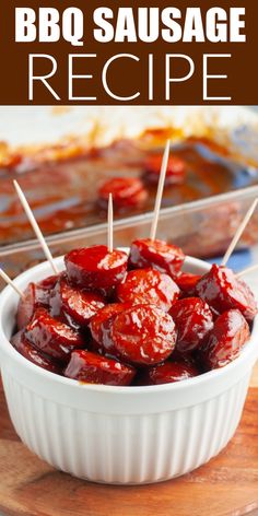 bbq sausage recipe in a white dish with toothpicks sticking out of it