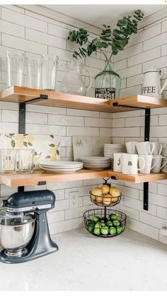 the kitchen shelves are filled with dishes and cups